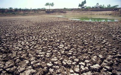 WARMING: Parched earth stretches almost to the horizon in a field near Gujarath, western India, in 2001. Picture: BLOOMBERG